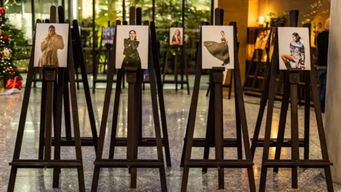 Getty Four of Liz Hatton's photographs of women stand on easels.