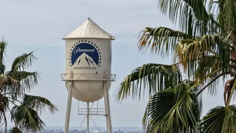 An aerial view of the Paramount logo is displayed on a water tower at the Paramount Studios lot in Los Angeles, California.