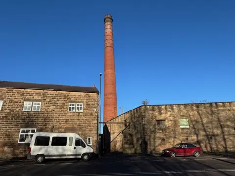 SDL Auctions A view of the chimney against a brilliant blue sky