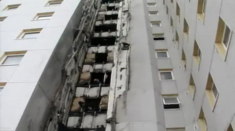 Fire damage to the 11-storey Knowlsey Heights block of flats