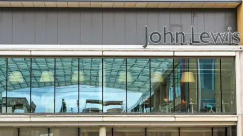 A general view picture of John Lewis in Oxford city centre with its logo in the top right of it.