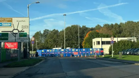 LDRS A general view picture of Bennet Road, a main road in Reading, with blue crash barriers around it.