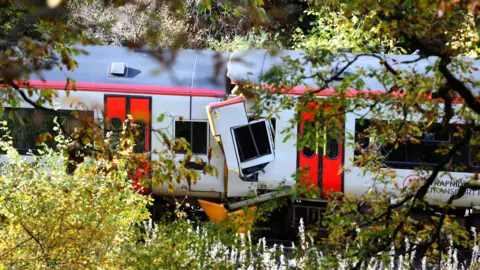 PA Media A Transport for Wales train that crashed in Powys