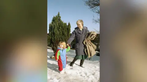 Kirstie Lumley This is an old photograph of the woman at the centre of this story playing in the snow with her granddaughter.  It looks as though it was taken when she was in her seventies and the granddaughter was about five.