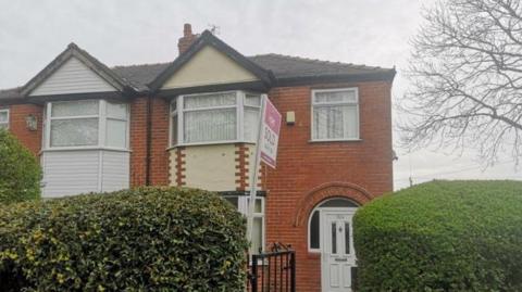 A front view of the two-bed semi-detached home in Stretford