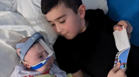 Supplied Two young boys in bed