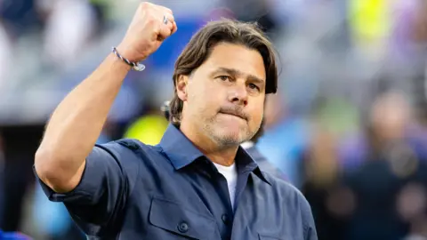 US man's team manager Mauricio Pochettino raises his fist in celebration