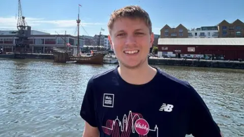 Mike Harper’s family and Cardiac Risk in the Young A young man smiling at the camera 