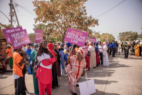Opponents of a bill aimed at decriminalising female genital mutilation protesting outside the National Assembly in Banjul, The Gambia