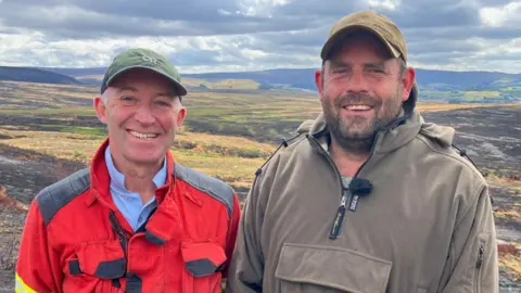BBC Richard Bailey and Jono Simmonds on moorland above Stalybridge