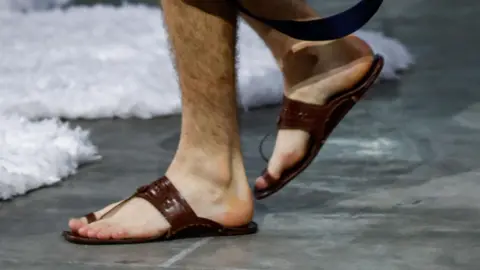 A model wearing Kolhapuri sandals in the 2025 Milan Fashion Show