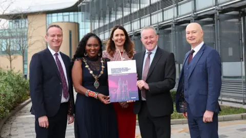 Derry City and Strabane District council Pictured at Ulster University's Derry~Londonderry campus at the launch of the Magee Expansion Taskforce's final report and Action Plan are (l-r) Stephen Kelly, Chair of the Magee Taskforce; Cllr Lilian Seenoi Barr, Mayor of Derry City and Strabane District Council; Nicola Skelly, Vice Chair of the Magee Taskforce; Economy Minister Conor Murphy; and Professor Paul Bartholomew, Vice-Chancellor of Ulster University.