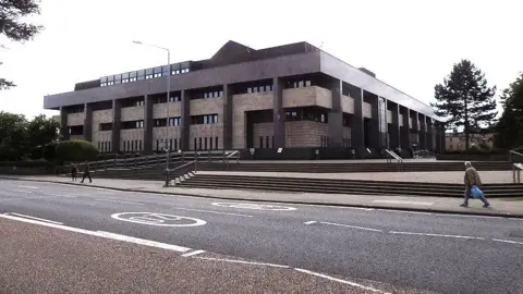 Glasgow Sheriff Court, a brutalist concrete building.