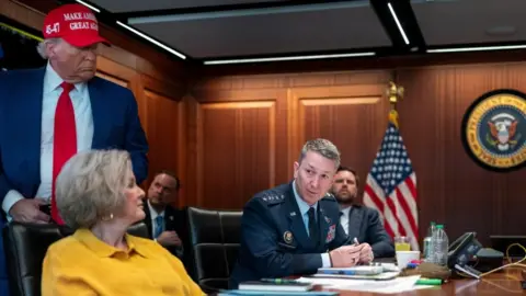 US President Donald Trump holds a meeting with White House Chief of Staff Susie Wiles, Chairman of the Joint Chiefs of Staff General Dan Caine and other cabinet members in the Situation Room at the White House on 21 June 2025