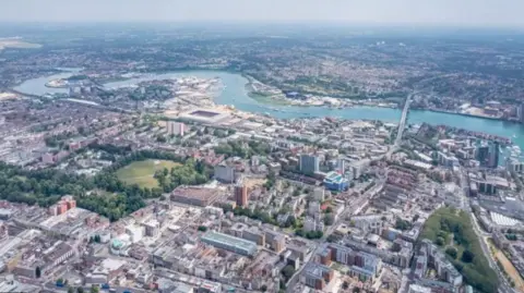 Aerial view of Southampton city with a winding river at the top of the image.