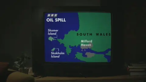 Black Waters: The Sea Empress Disaster A TV showing a news piece from 1996 illustrating where the Sea Empress had run aground.  