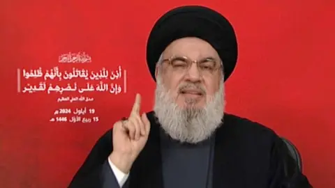 Reuters Hassan Nasrallah delivering a speech to camera