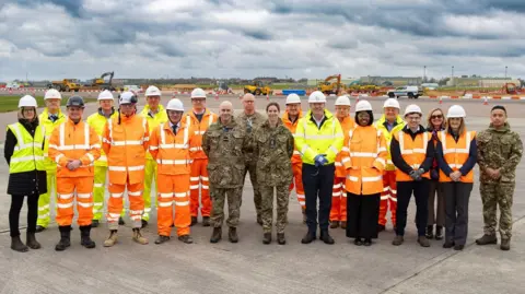 MOD Crown Copyright The project team at Brize Norton ahead of the start of works pose for a group photo.