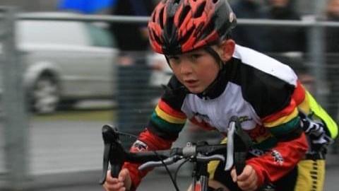 A young Josh Tarling rides his bike