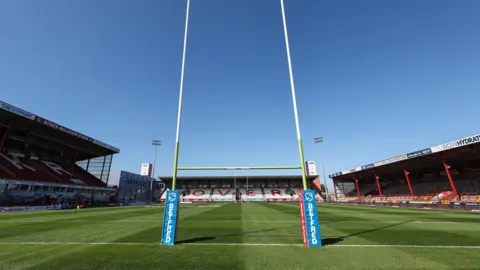 BBC A general view of the interior of Craven Park. There are three large stands arranged around a green pitch, with posts in the foreground.