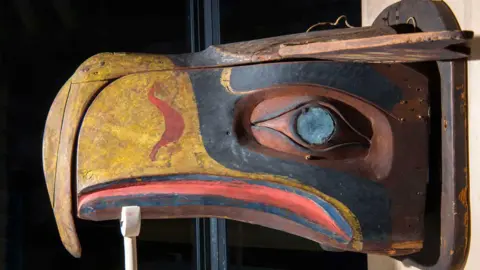 Burke Museum of Natural History and Culture The original mask of a bird, with a yellow beak and red and blue colouring