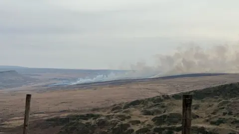 Richard Noon A far away shot of a moorland fire in West Yorkshire