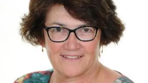 Osmaston CoE Primary School A woman with dark hair and glasses