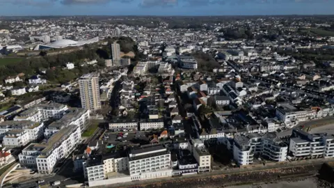 An aerial view of St Helier in Jersey showing various sizes or buildings. 