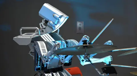 Getty Images A robot playing drums at Worldcon 2023