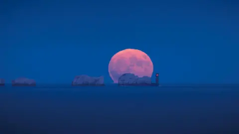 BBC Weather Watcher Infocus The full strawberry moon rising above the Needles on the Isle of Wight taken from Highcliffe beach