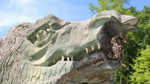 Friends of Crystal Palace Dinosaurs A close look at a heavily damaged dinosaur face.
