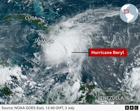 A satellite image shows the hurricane spanning Jamaica and Cuba