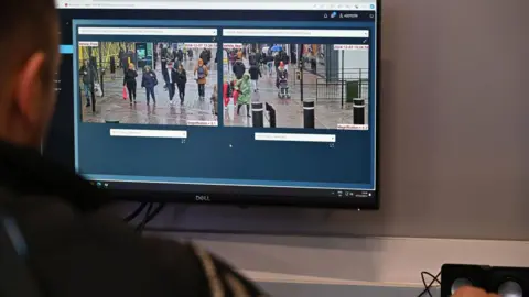 Getty Images A police officer views a monitor in a live facial recognition van on the High Street in Southend.