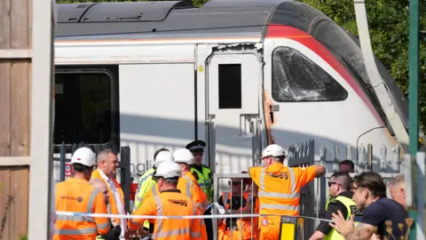 The Greater Anglia train involved in an incident after it derailed from tracks in Wickford, Essex. A number of emergency personnel are at the scene of the train and a cordon of tape is in place to keep people away from the area.