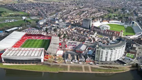 Aerial image with the River Trent in the foreground, with the City Ground and Trent Bridge Cricket Ground behind