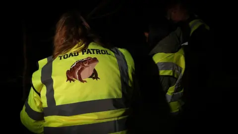 Rod Kirkpatrick/RKP Photography Volunteer wearing a high vis jacket saying "Toad Patrol"