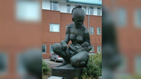 A statue of a mother and baby outside Liverpool Women's Hospital