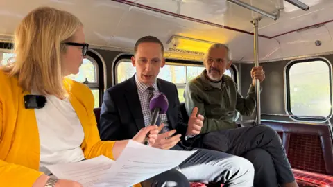 Sophie Law quizzes Luke Marion as Graham MacDonald watches on.