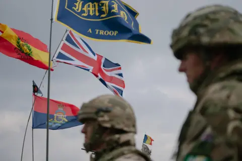 Regimental flags, including a British Union flag, at the Steadfast Dart 25 exercise, part of the Nato Allied Reaction Force (ARF) training in Romania