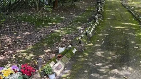 Memorial gardens close up photo of plaques and flowers