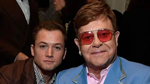 LOS ANGELES, CALIFORNIA - JANUARY 04: (L-R) Taron Egerton and Elton John attend The BAFTA Los Angeles Tea Party at Four Seasons Hotel Los Angeles at Beverly Hills on January 04, 2020 in Los Angeles, California.