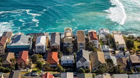An aerial view of waterfront homes in Sydney