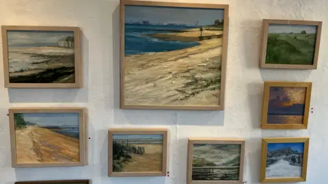 A selection of his paintings of beach scenes painted in an impressionistic style.