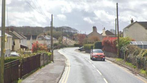 An orange Renault driving down Main Road/North Road near Coleford