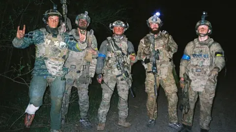 Conall Kearney Soldiers stood together following the ambush