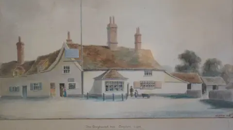Jamie Niblock/BBC A picture of the painting of the Greyhound pub in Claydon