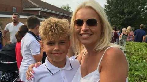 Family handout Hayley pictured on the right with a younger Mikey Roynon