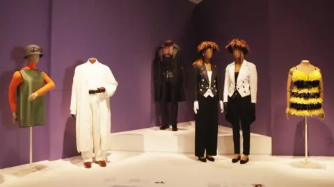 Stage outfits worn by (L-R) Poly Styrene, Billy Ocean, Seal, Mel & Kim and Rowetta