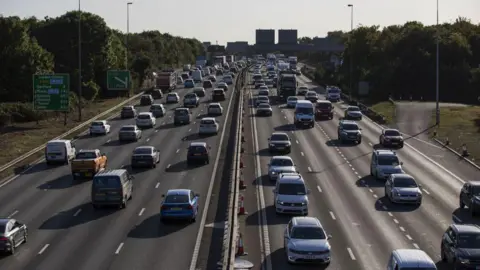Traffic travels in both directions on the M20 motorway near Dartford, UK, on Wednesday 18 Sept 2019