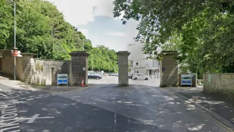 Google Maps The entrance to a car park with pillars outside